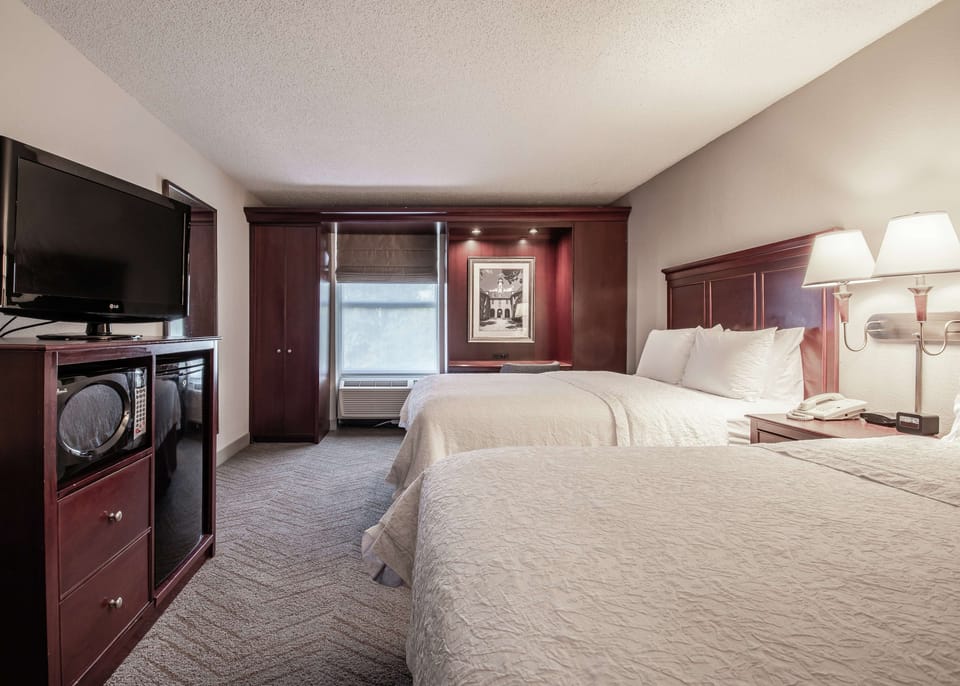 Standard Room, 2 Queen Beds | In-room safe, desk, laptop workspace, blackout drapes