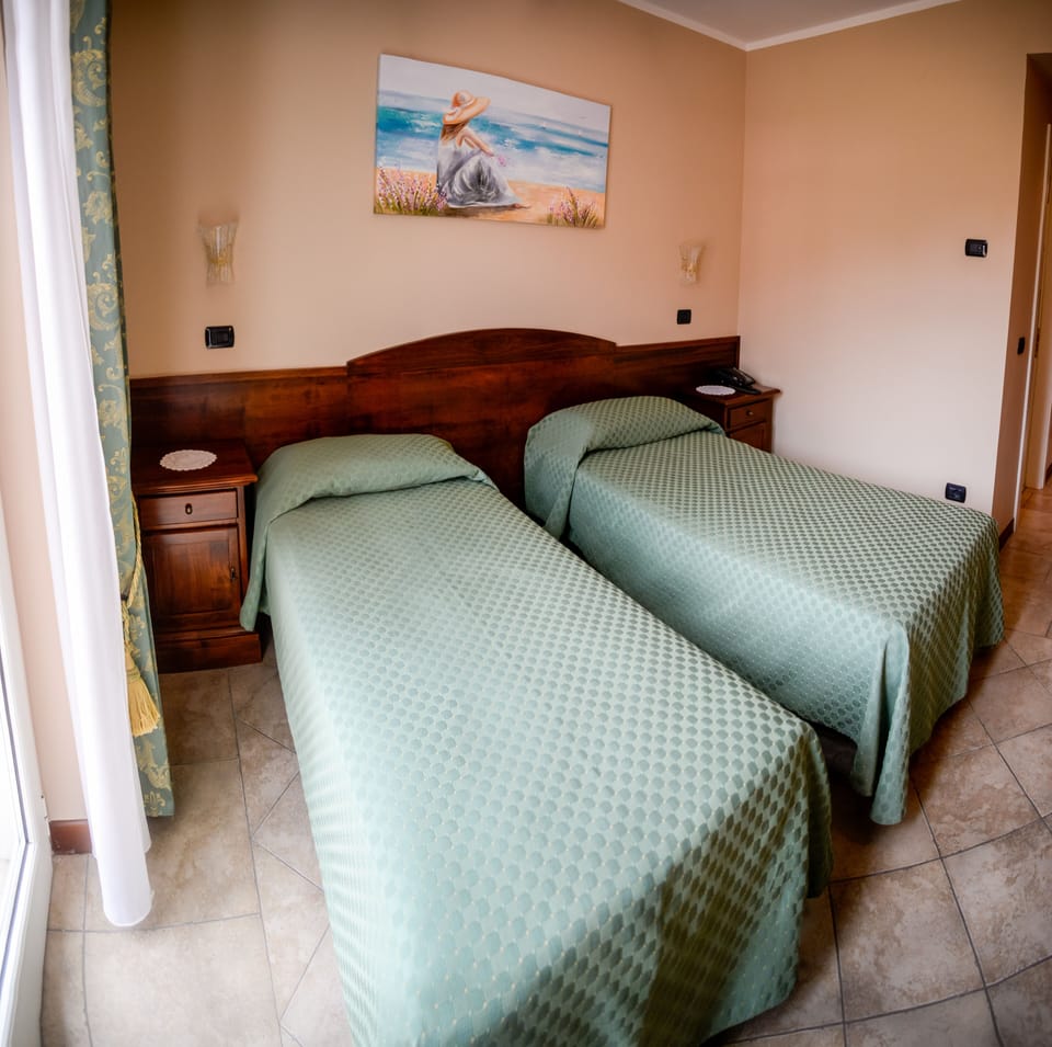 Classic Double Room Single Use, Garden View | 1 bedroom, in-room safe, desk, blackout drapes