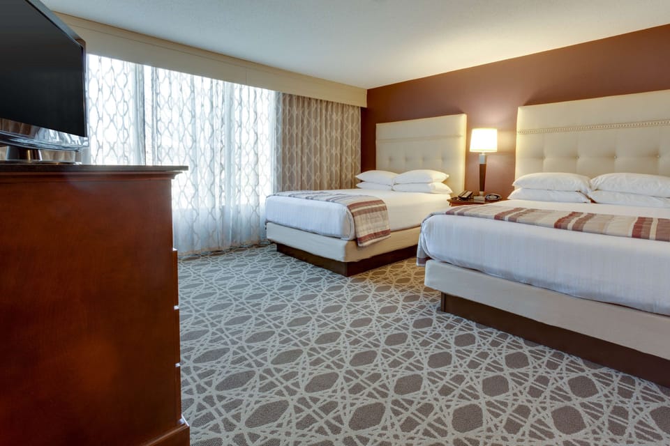 Pillowtop beds, desk, blackout drapes, iron/ironing board