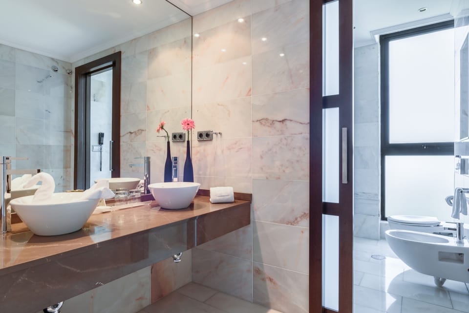 Bathtub, eco-friendly toiletries, hair dryer, towels