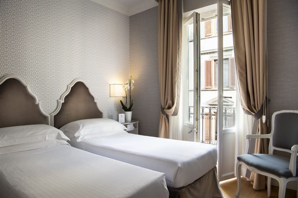 Premium bedding, down comforters, free minibar items, in-room safe
