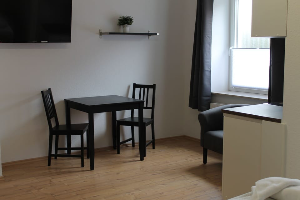 Double Room | Living area | 32-inch flat-screen TV with satellite channels, TV