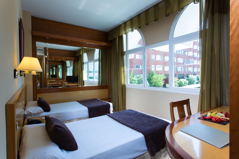 Twin Room | Minibar, in-room safe, desk, soundproofing