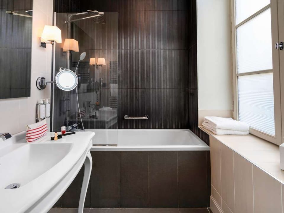 Bathtub, deep soaking tub, eco-friendly toiletries, hair dryer