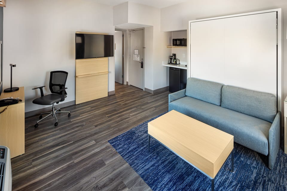 Premium bedding, down comforters, laptop workspace, blackout drapes
