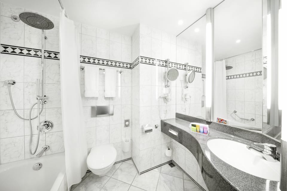 Rainfall showerhead, eco-friendly toiletries, hair dryer, towels