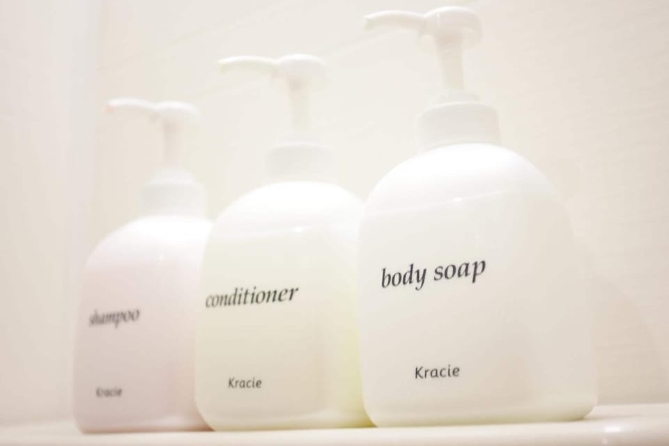 Hair dryer, slippers, towels, shampoo