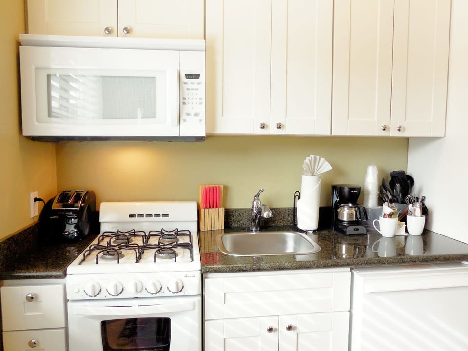 Deluxe Room, 2 Queen Beds | Private kitchen | Fridge, microwave, coffee/tea maker