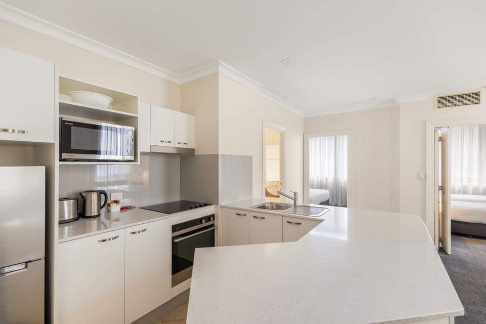 Apartment, 2 Bedrooms | Private kitchen | Mini-fridge, microwave, stovetop, coffee/tea maker