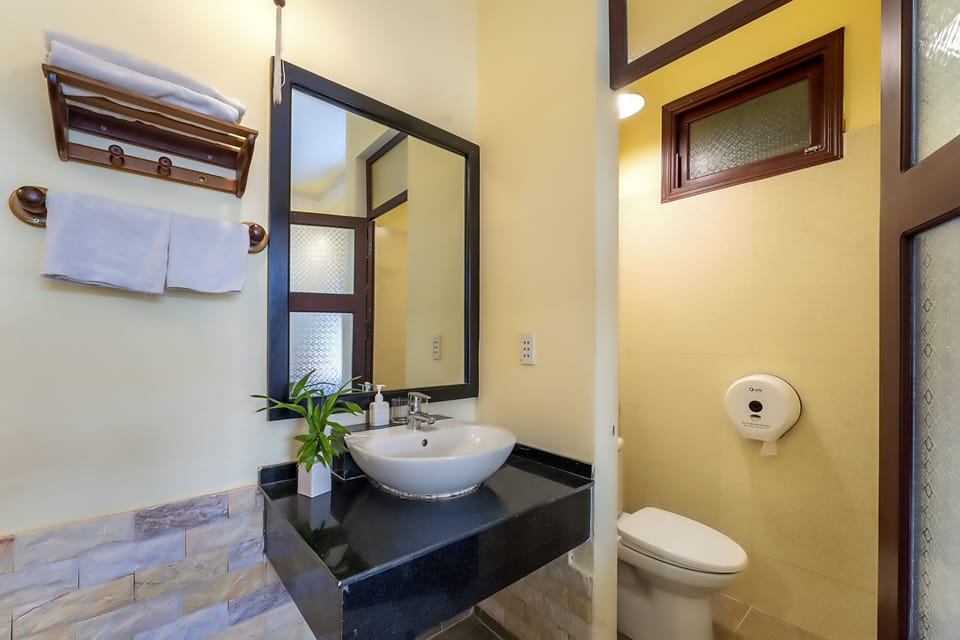 Shower, free toiletries, hair dryer, slippers