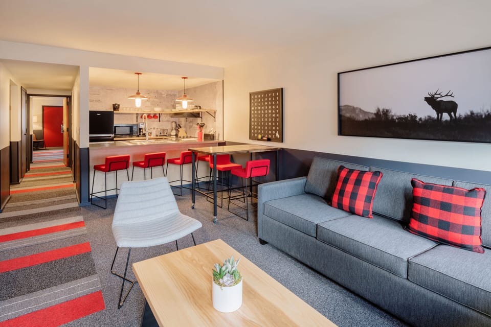 Suite, Multiple Beds, Kitchen | Living area | 34-inch LCD TV with cable channels, TV
