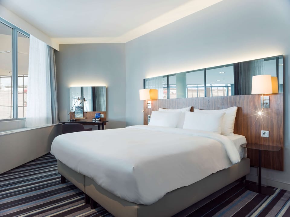 Junior Suite (Runway View) | Hypo-allergenic bedding, minibar, in-room safe, desk