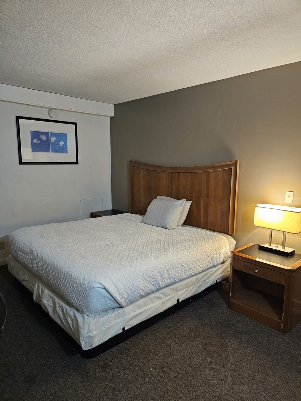 Desk, laptop workspace, iron/ironing board, bed sheets