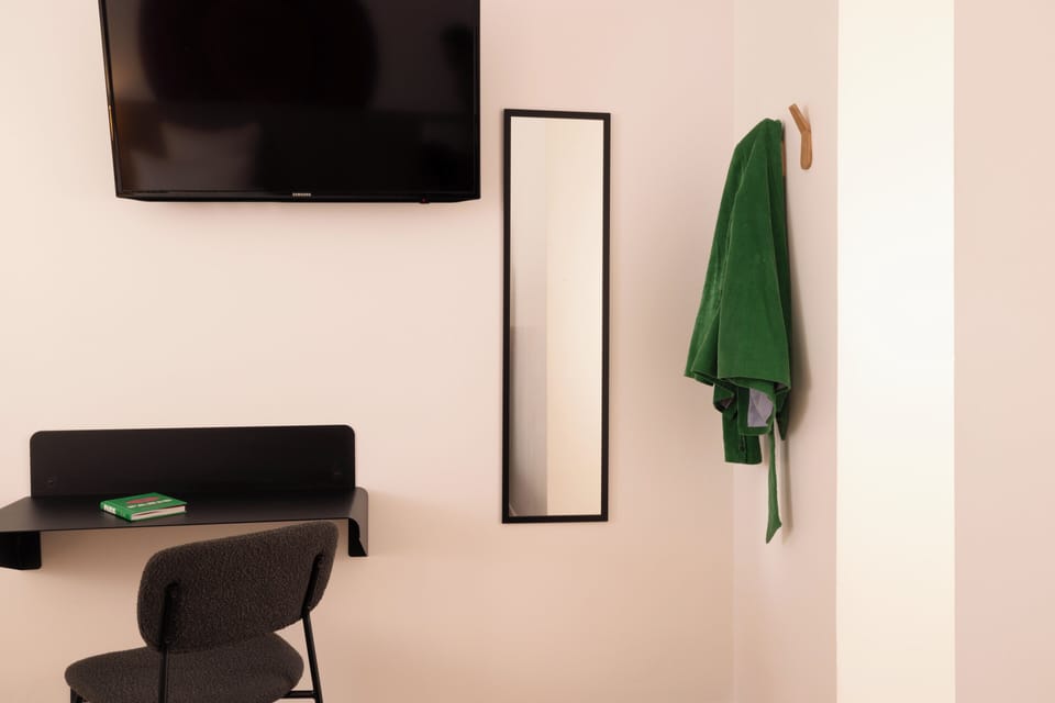 Family Room | Desk, blackout drapes, soundproofing, iron/ironing board