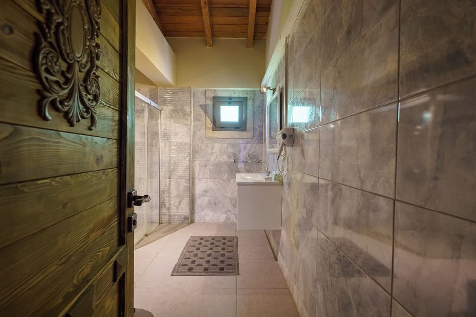 Senior Condo | Bathroom | Shower, rainfall showerhead, bathrobes, slippers