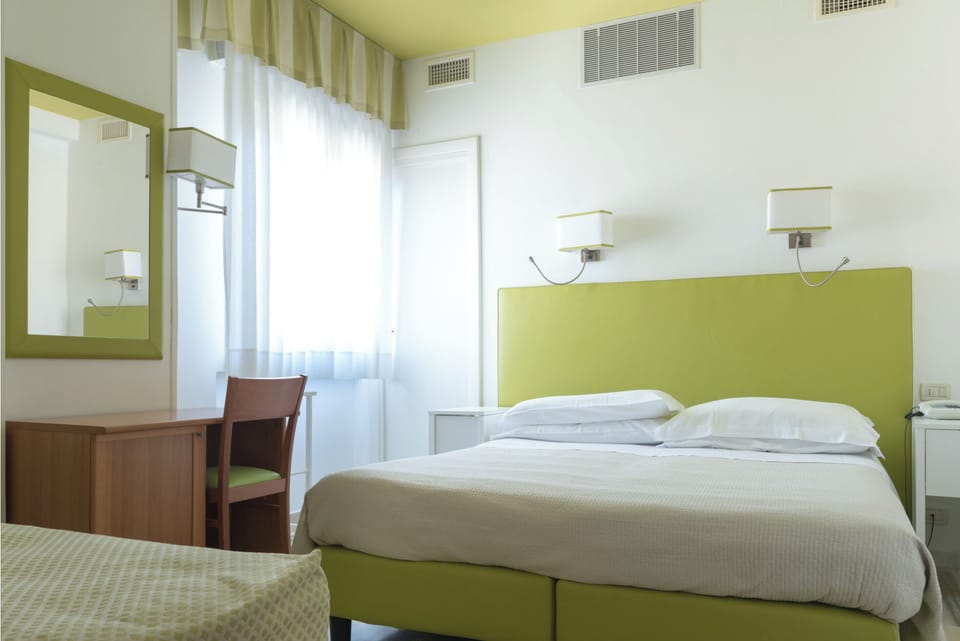 Classic Triple Room | Minibar, in-room safe, individually decorated, individually furnished