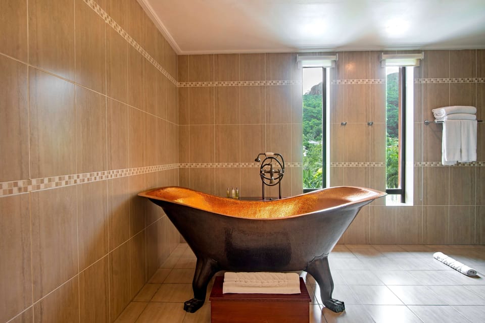 Grand Room, 1 King Bed, Beach View, Jacuzzi on Balcony | Bathroom | Shower, free toiletries, hair dryer, bathrobes