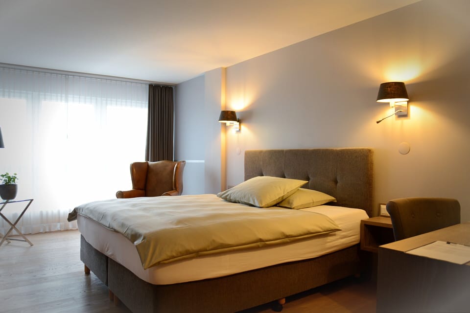 Premium bedding, down comforters, memory foam beds, in-room safe
