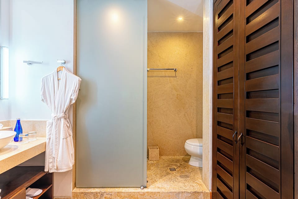 Shower, rainfall showerhead, designer toiletries, hair dryer