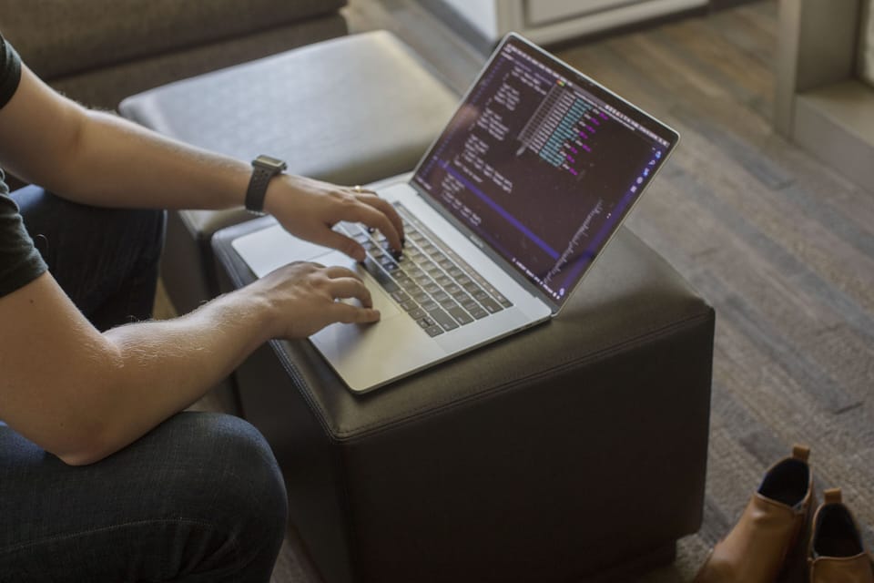 Premium bedding, desk, laptop workspace, blackout drapes