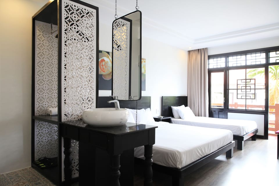 Deluxe Triple Room, Non Smoking, Balcony | Minibar, in-room safe, soundproofing, free WiFi