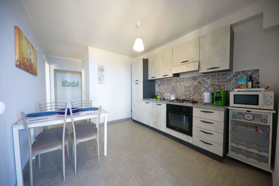 Basic Apartment, 2 Bedrooms, Sea View | Private kitchen | Electric kettle, highchair, coffee grinder, freezer