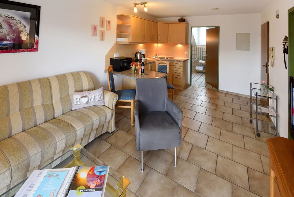 Condo, Balcony | Living area | 32-inch TV with satellite channels
