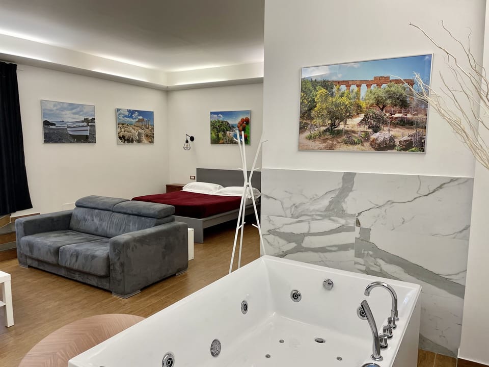 Panoramic Studio Suite, Jetted Tub, Sea View | Desk, laptop workspace, blackout drapes, iron/ironing board