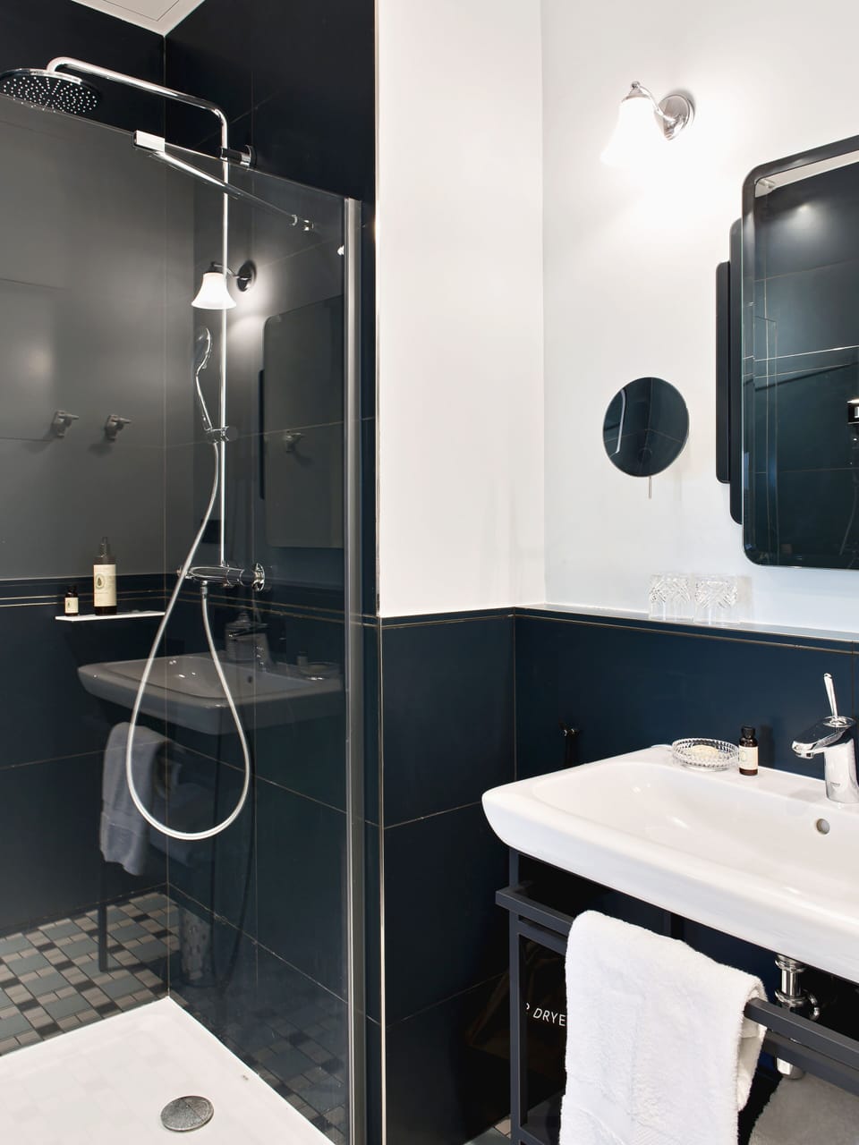 Designer toiletries, hair dryer, slippers, towels