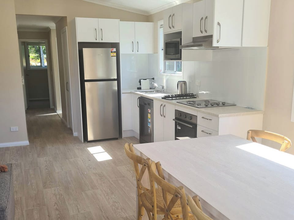 Superior Poolside 3 Bedroom Cabin | Private kitchen | Coffee/tea maker, full-size fridge, microwave, dining table