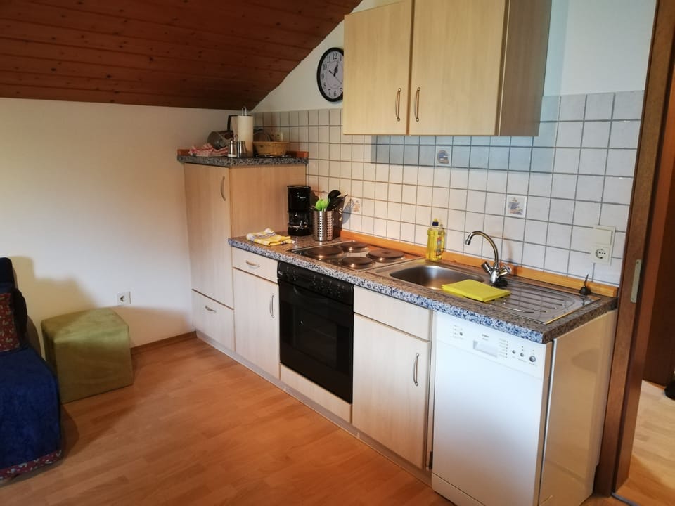 Apartment, 2 Bedrooms | Private kitchen | Stovetop, coffee/tea maker, highchair
