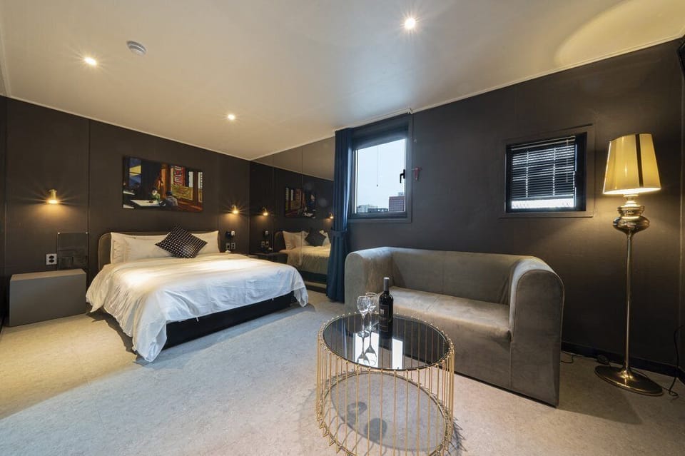 Mirror | Premium bedding, desk, laptop workspace, soundproofing