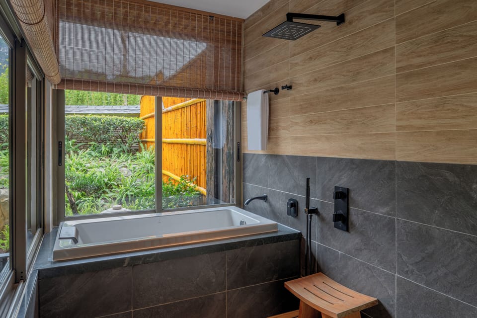 Shower, free toiletries, hair dryer, slippers