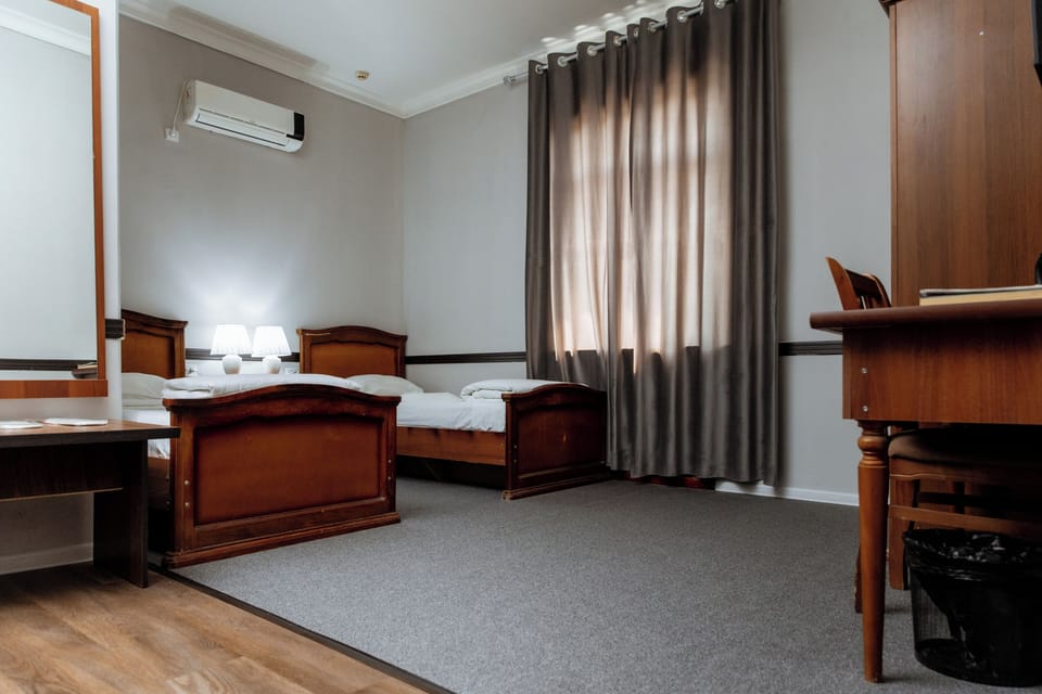 Basic Twin Room | Desk, blackout drapes, iron/ironing board (on request), WiFi (free)