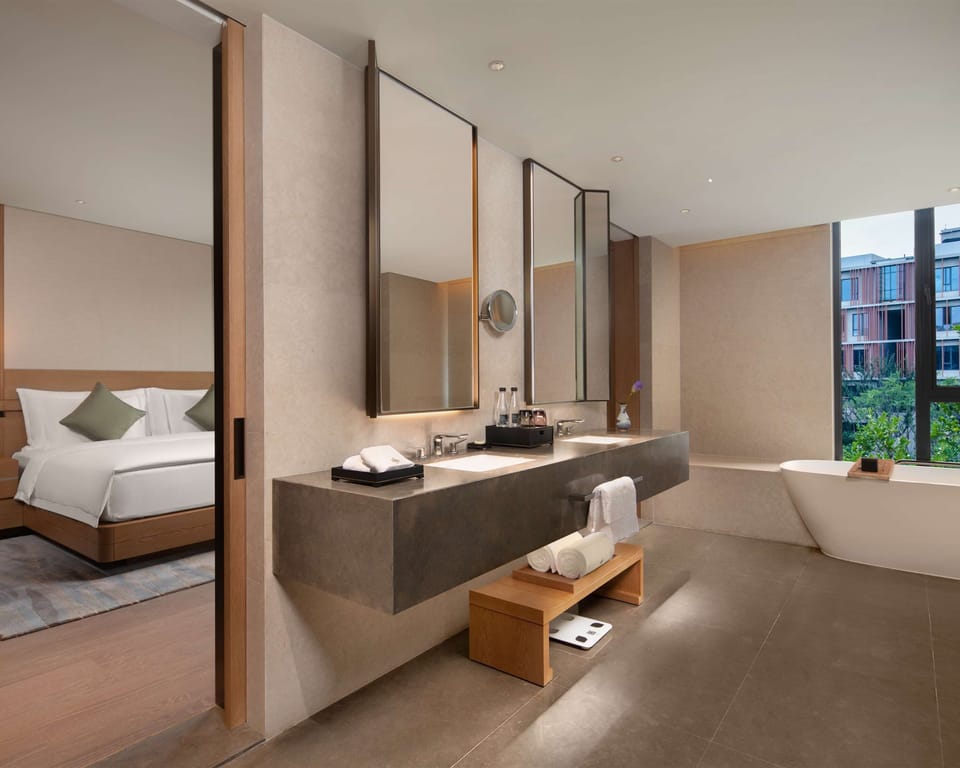1 King Bed Premium | Bathroom | Separate tub and shower, rainfall showerhead, designer toiletries