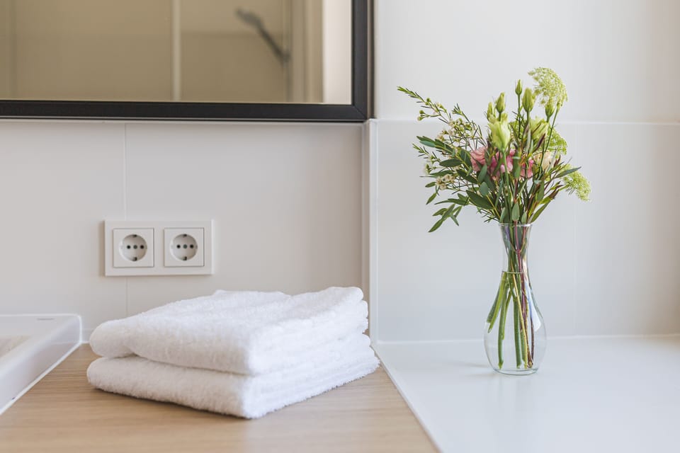 Designer toiletries, hair dryer, towels, soap