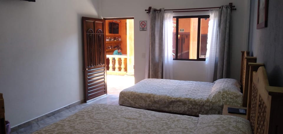 Basic Quadruple Room, 2 Queen Beds | Laptop workspace, free WiFi, bed sheets