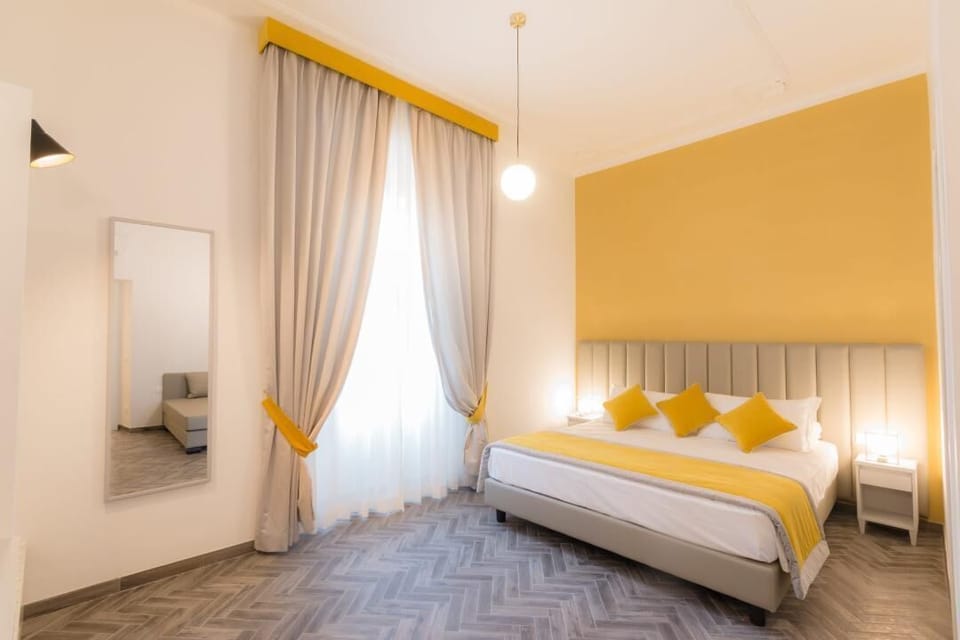 Deluxe Triple Room | Minibar, in-room safe, individually decorated, individually furnished
