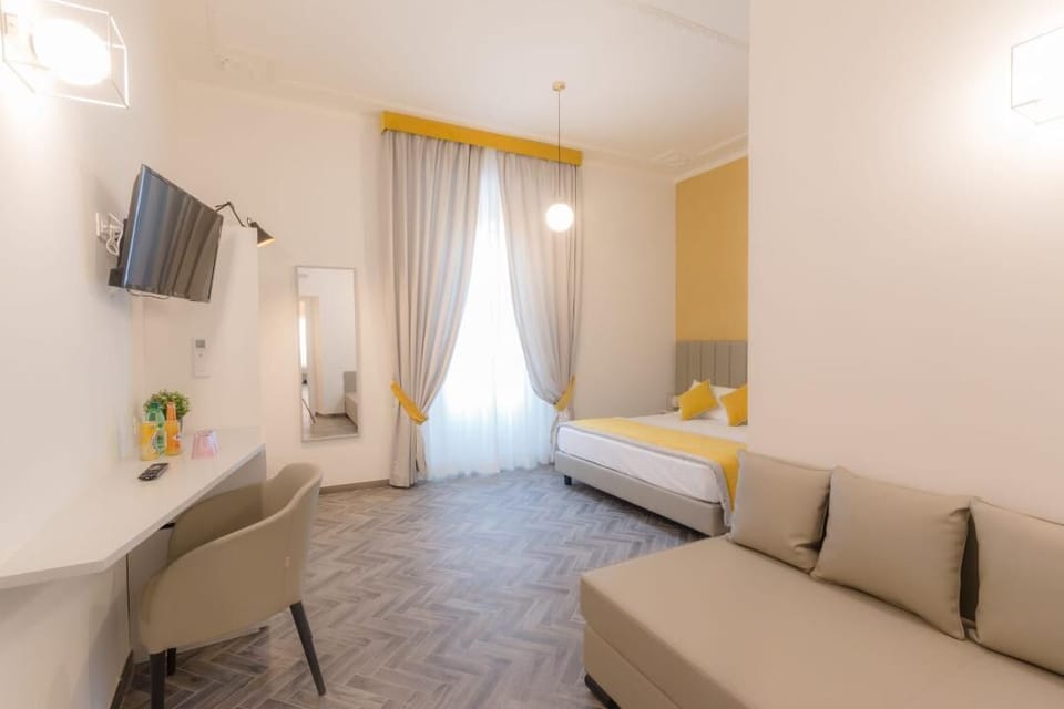Deluxe Triple Room | Minibar, in-room safe, individually decorated, individually furnished