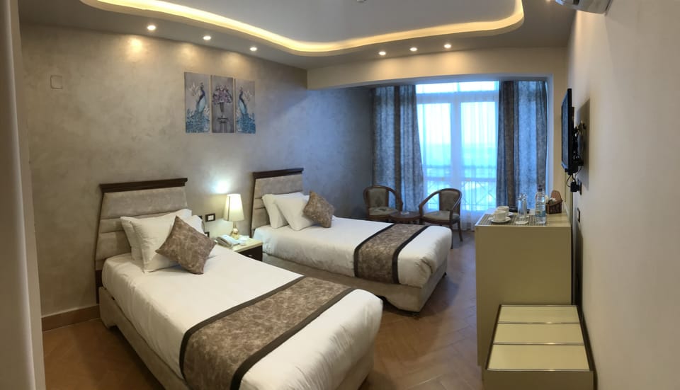 Egyptian cotton sheets, premium bedding, minibar, in-room safe