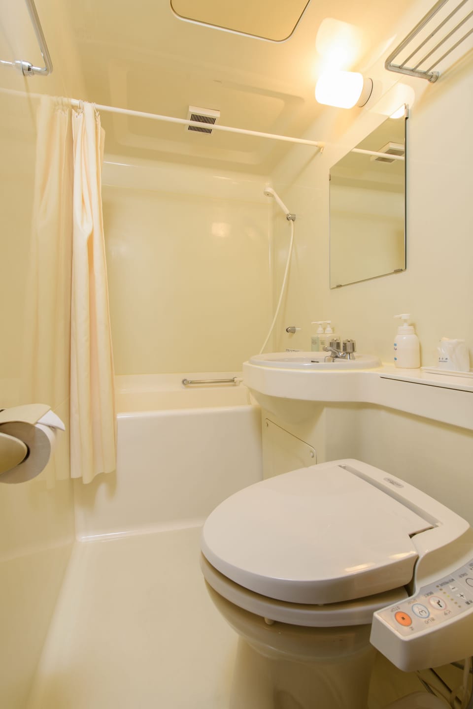 Combined shower/tub, free toiletries, hair dryer, slippers