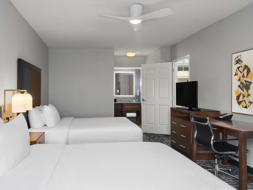 Down comforters, pillowtop beds, in-room safe, desk