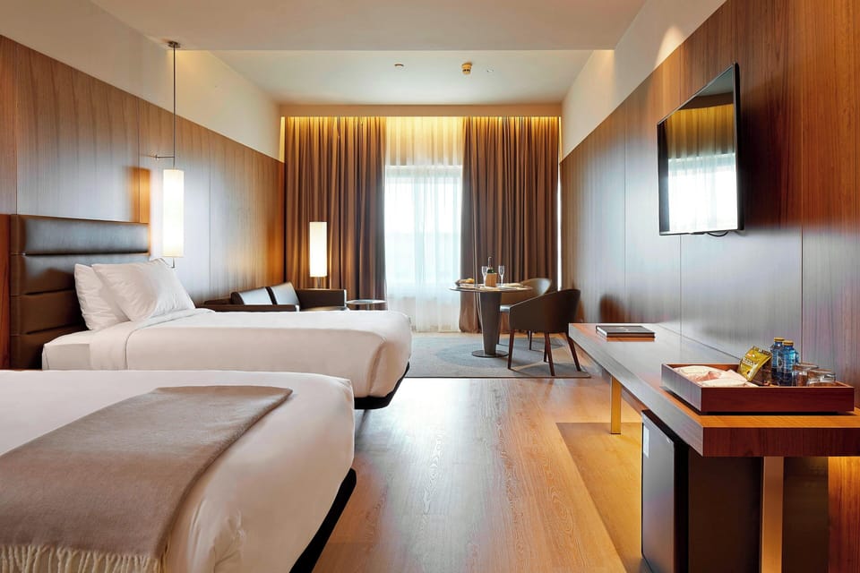 Egyptian cotton sheets, down comforters, memory foam beds, minibar