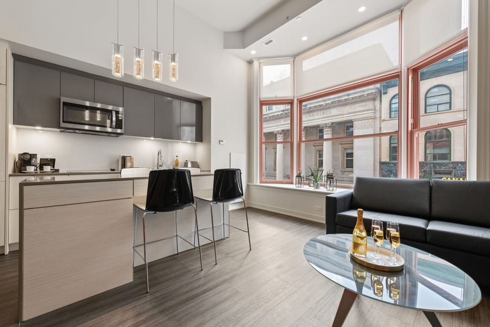 Heritage Loft | Living area | 55-inch TV with satellite channels, streaming services