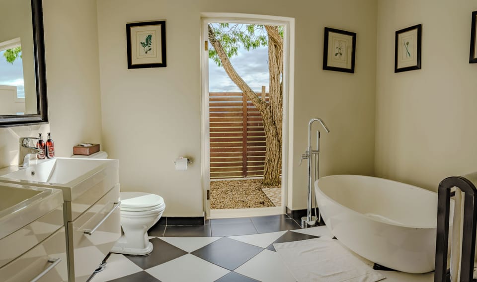 Luxury Suite, 1 King Bed | Bathroom | Separate tub and shower, deep soaking tub, free toiletries, hair dryer