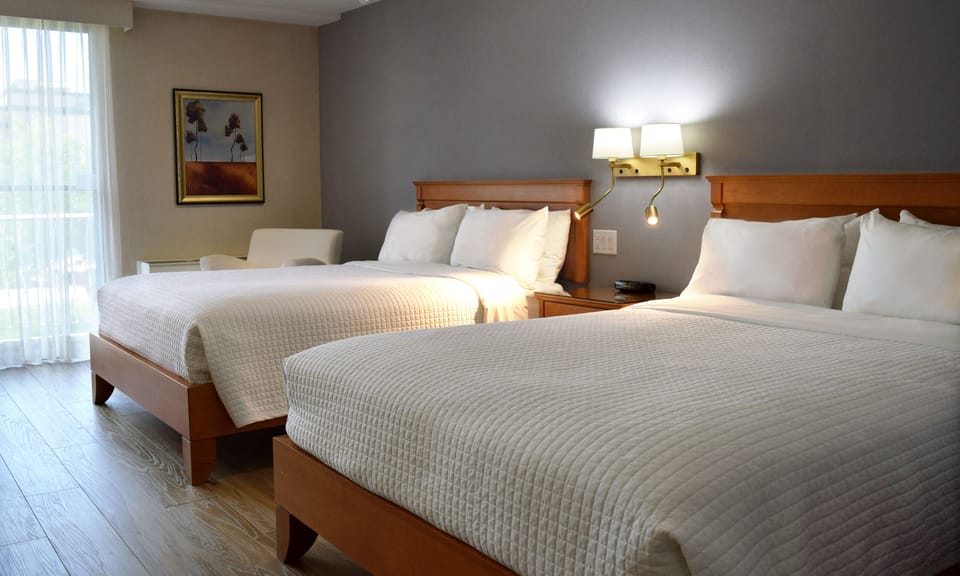 Room, 2 Queen Beds, Garden View | Desk, laptop workspace, blackout drapes, soundproofing