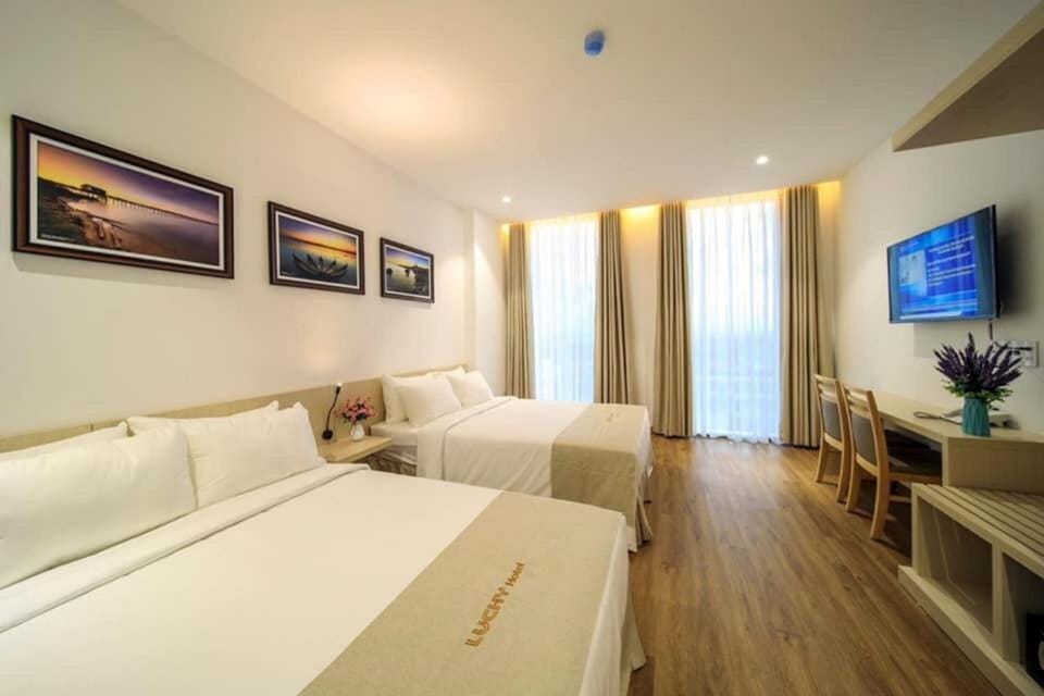 Family Quadruple Room | Minibar, in-room safe, desk, blackout drapes