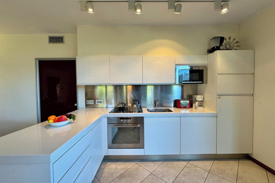 Honeymoon Apartment, Multiple Bedrooms, 2 Bathrooms, Mountainside (La Perla Di Sonenga - Giardino) | Private kitchen | Fridge, microwave, oven, stovetop