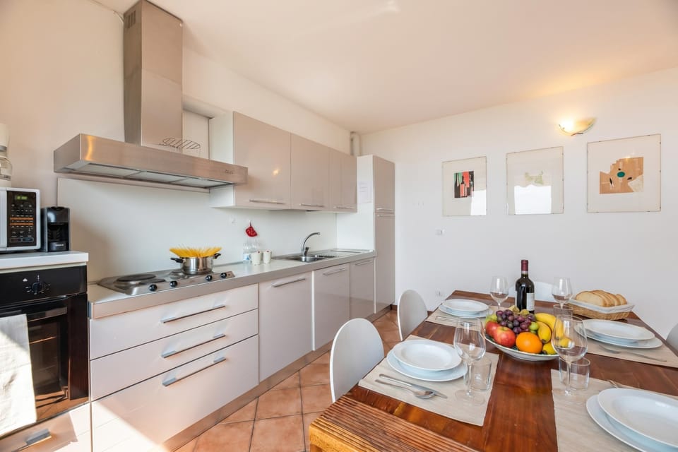 Family Apartment, Multiple Bedrooms, Mountainside (Alto Perledo Terrazzo) | Private kitchen | Fridge, microwave, oven, stovetop