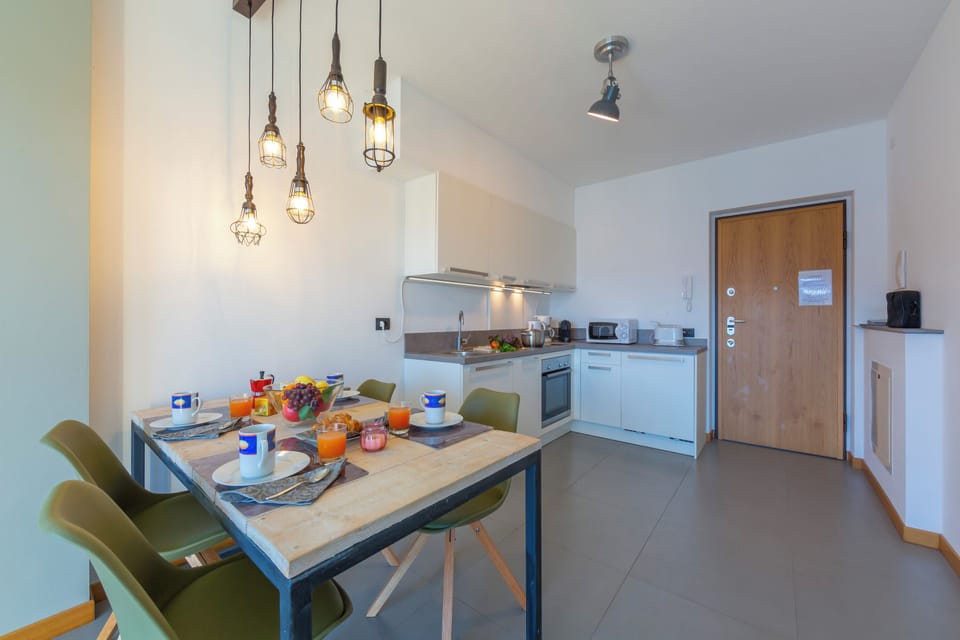 Family Apartment, 2 Bedrooms, Microwave, Mountainside (Residence degli Oleandri 2A) | Dining